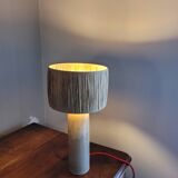 Sandstone lamp with raffia shade