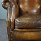 Patinated sheepskin armchair