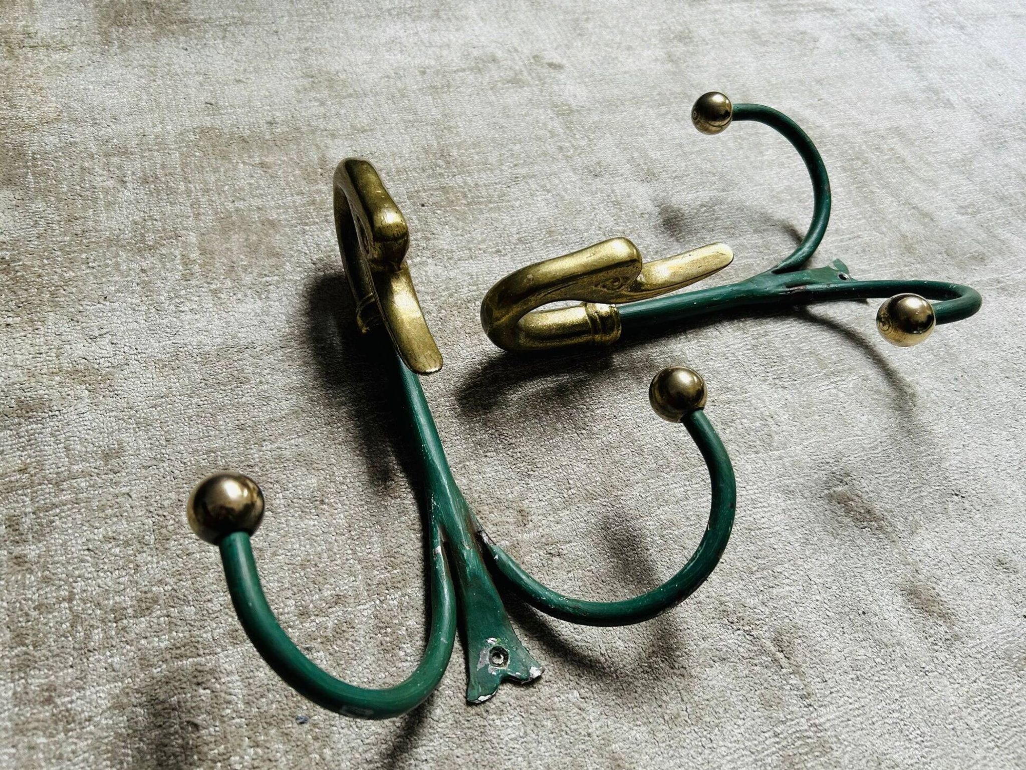 Rare set of swan neck coat hooks with mirror frame attributed to Maison Jansen, France, 1950s.