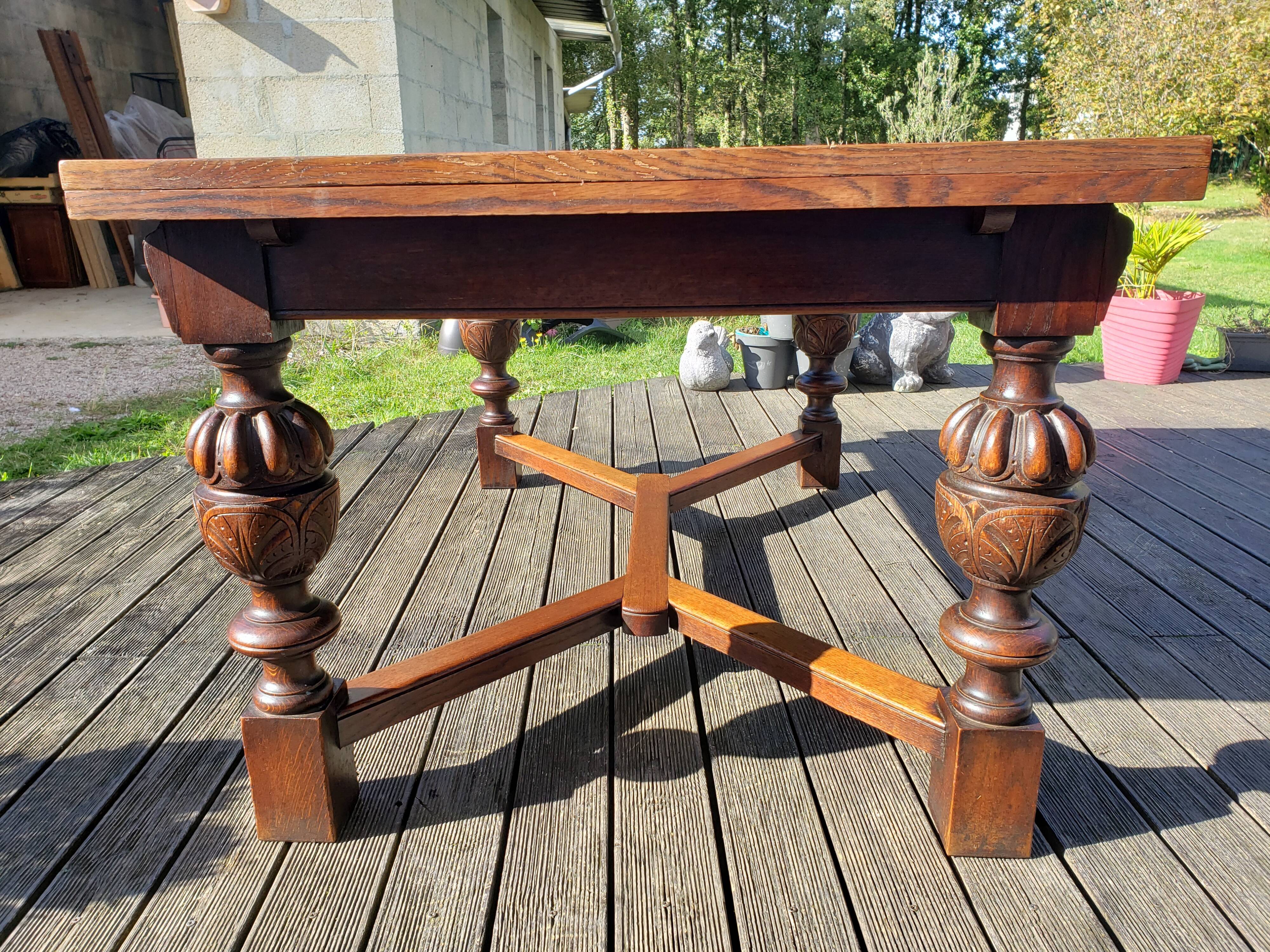 1910s Jacobean style solid oak extending drawer dining table
