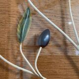 Round wrought iron and glass tray decorated with olives and foliage