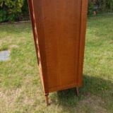 Tall chest of drawers in wood and rattan with splayed legs