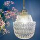 Suspension globe vintage en verre moulé transparent