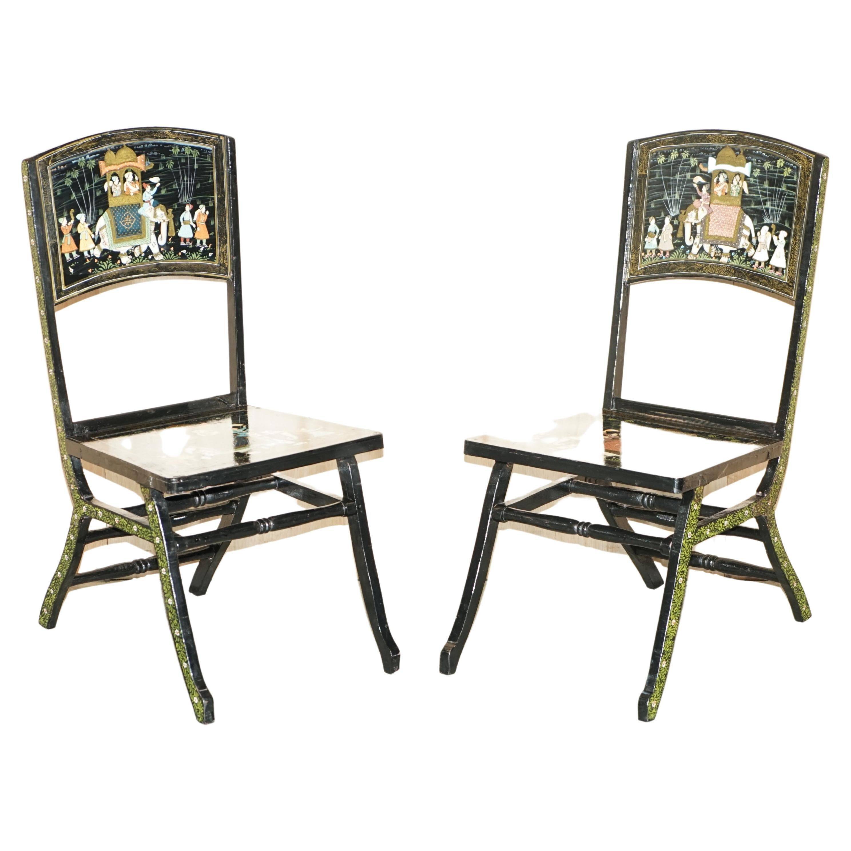 Pair of military folding chairs with Indian decoration.