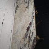 Louis XVI style console in gilded wood with a marble top.