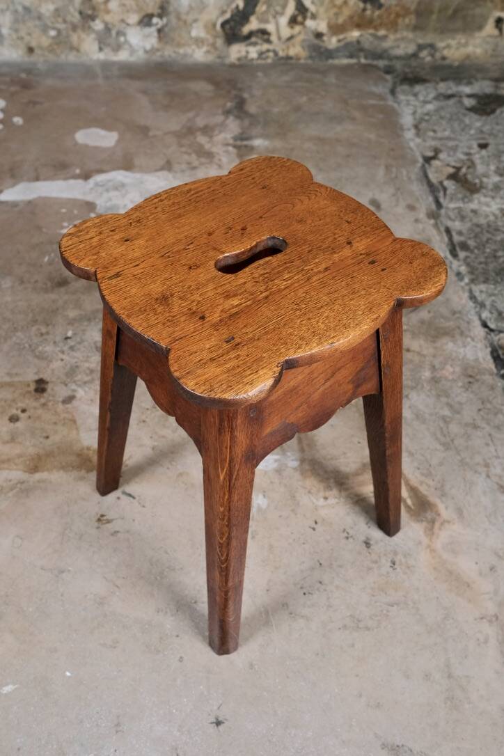 Pair of scalloped oak stools, France, early 20th century