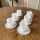 Espresso coffee cup service, Nestlé promotional items, in white glass.
