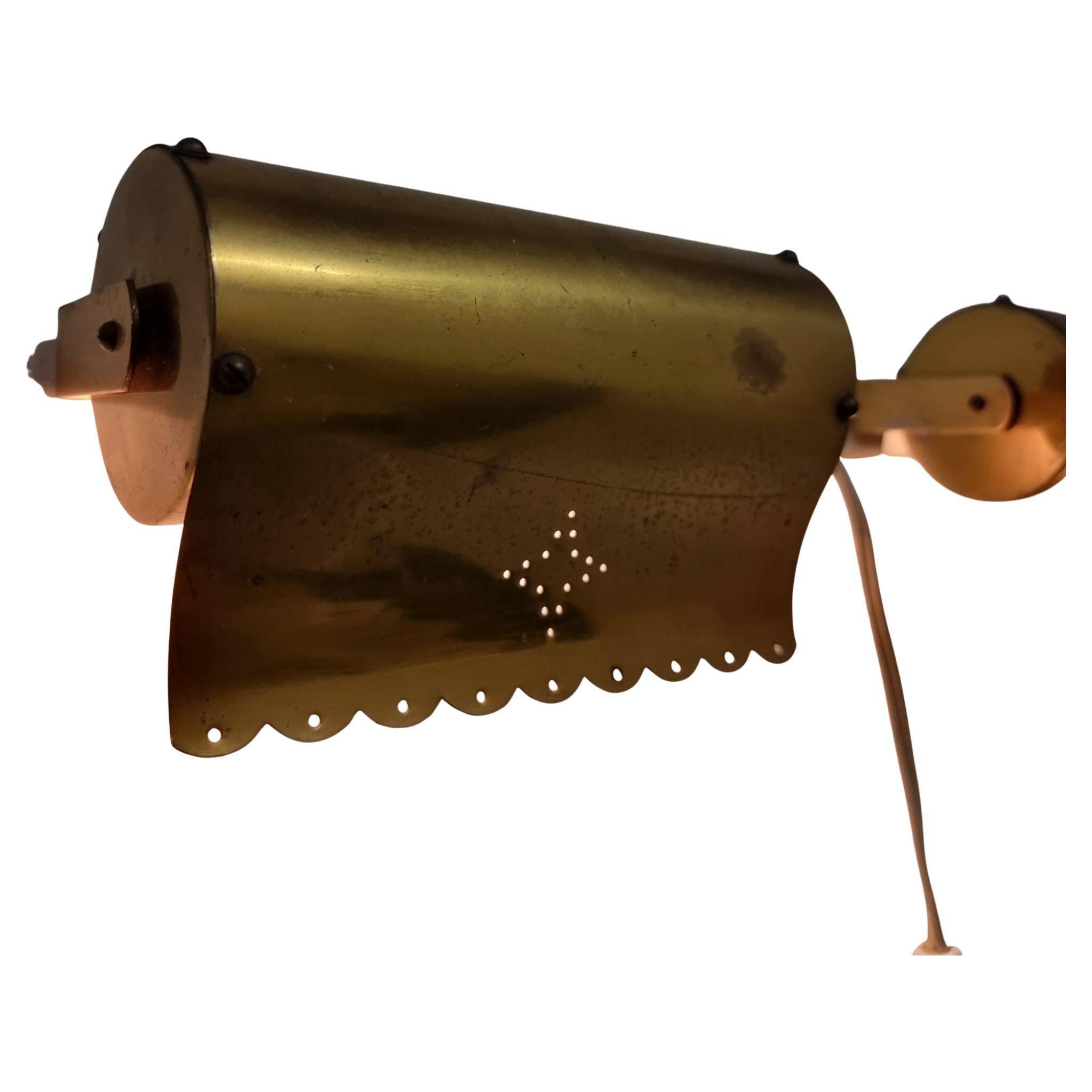 A pair of charming wall sconces/branches in brass with a star pattern, modern Scandinavian style.