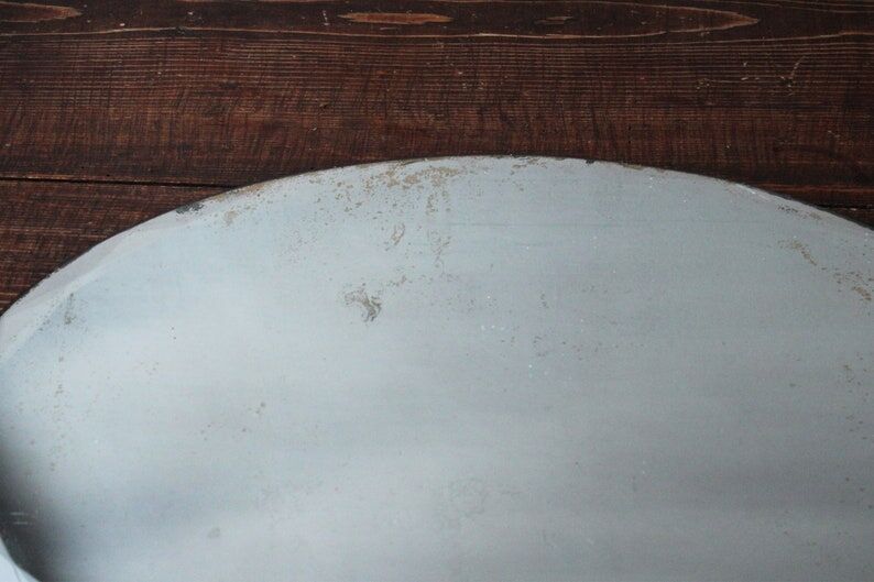 Old oval beveled art deco mirror