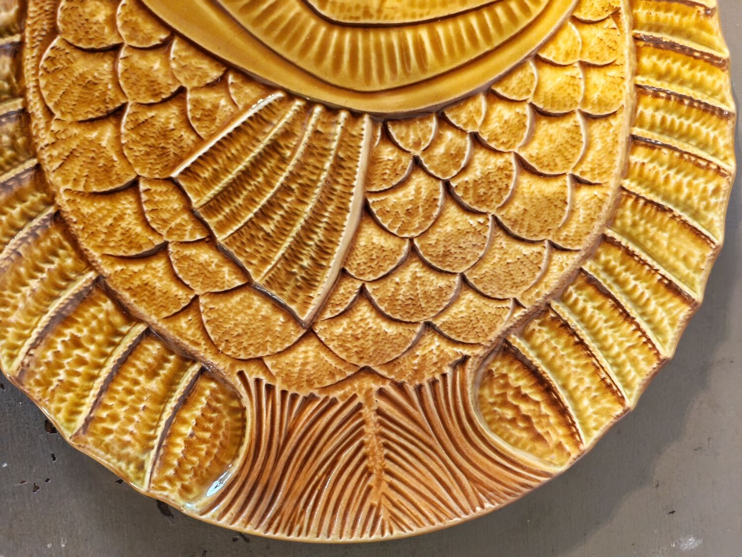 Vintage barbotine plates with fish decoration, 22 pieces.