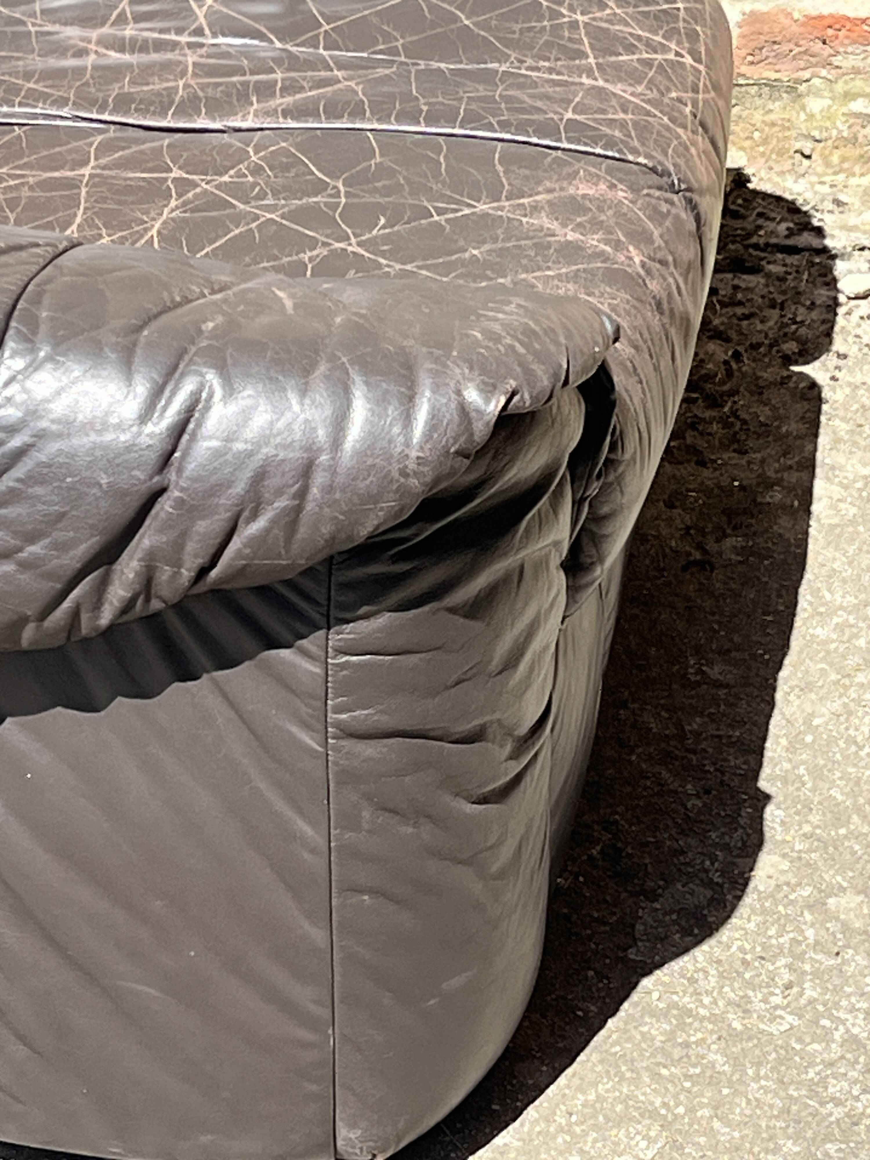 Pair of patinated leather club armchairs