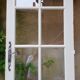 Old wooden door with small squares
