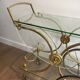 Neo classical style table in silver and gold metal and glass