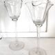 Pair of glass candlesticks on a stand