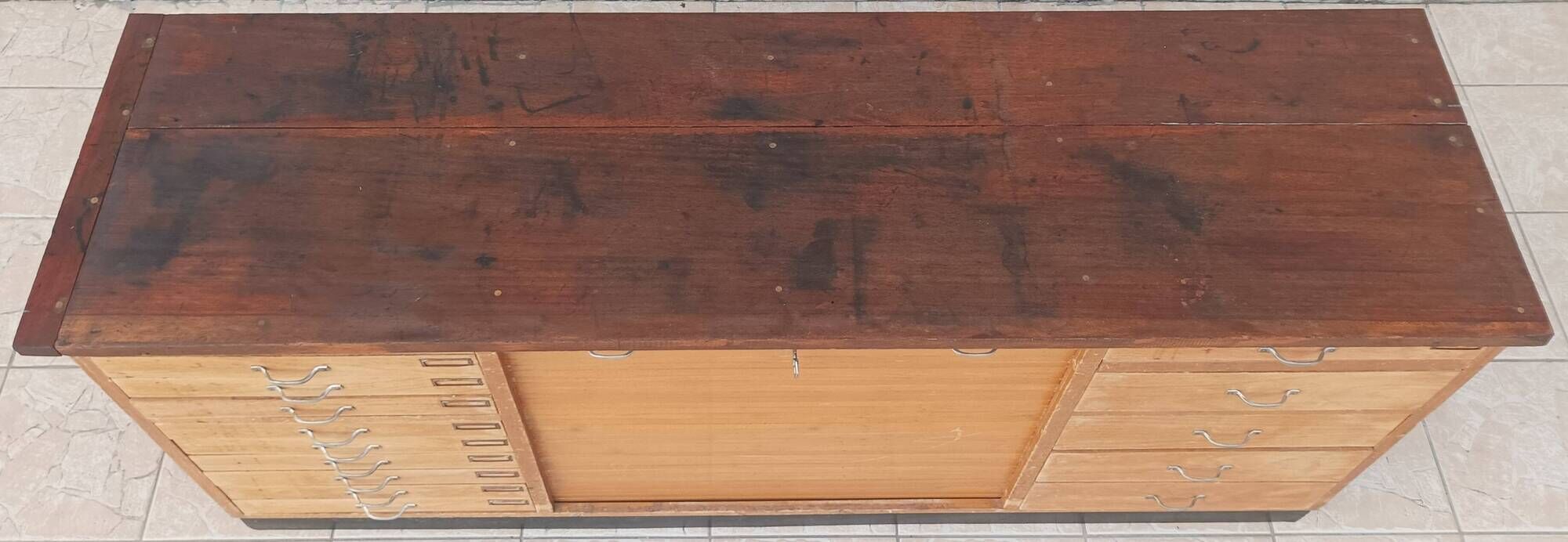 Workshop furniture with drawers and curtain in beech and walnut.