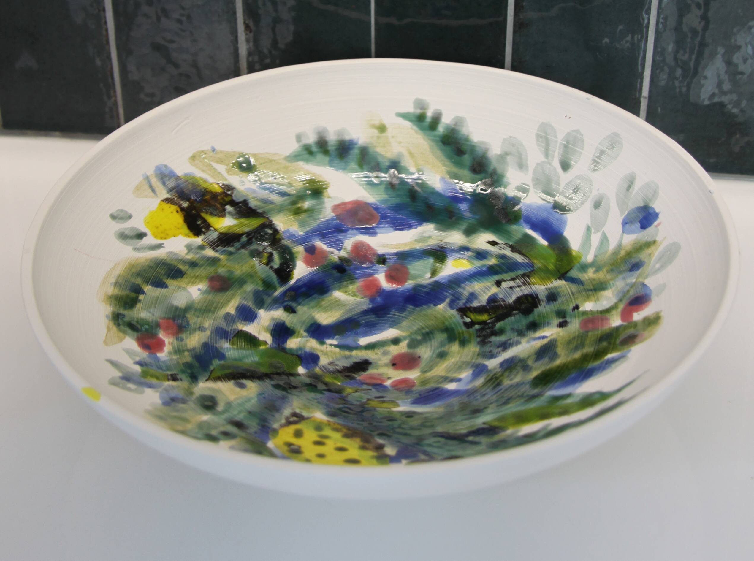 Decorated white earthenware fruit bowl