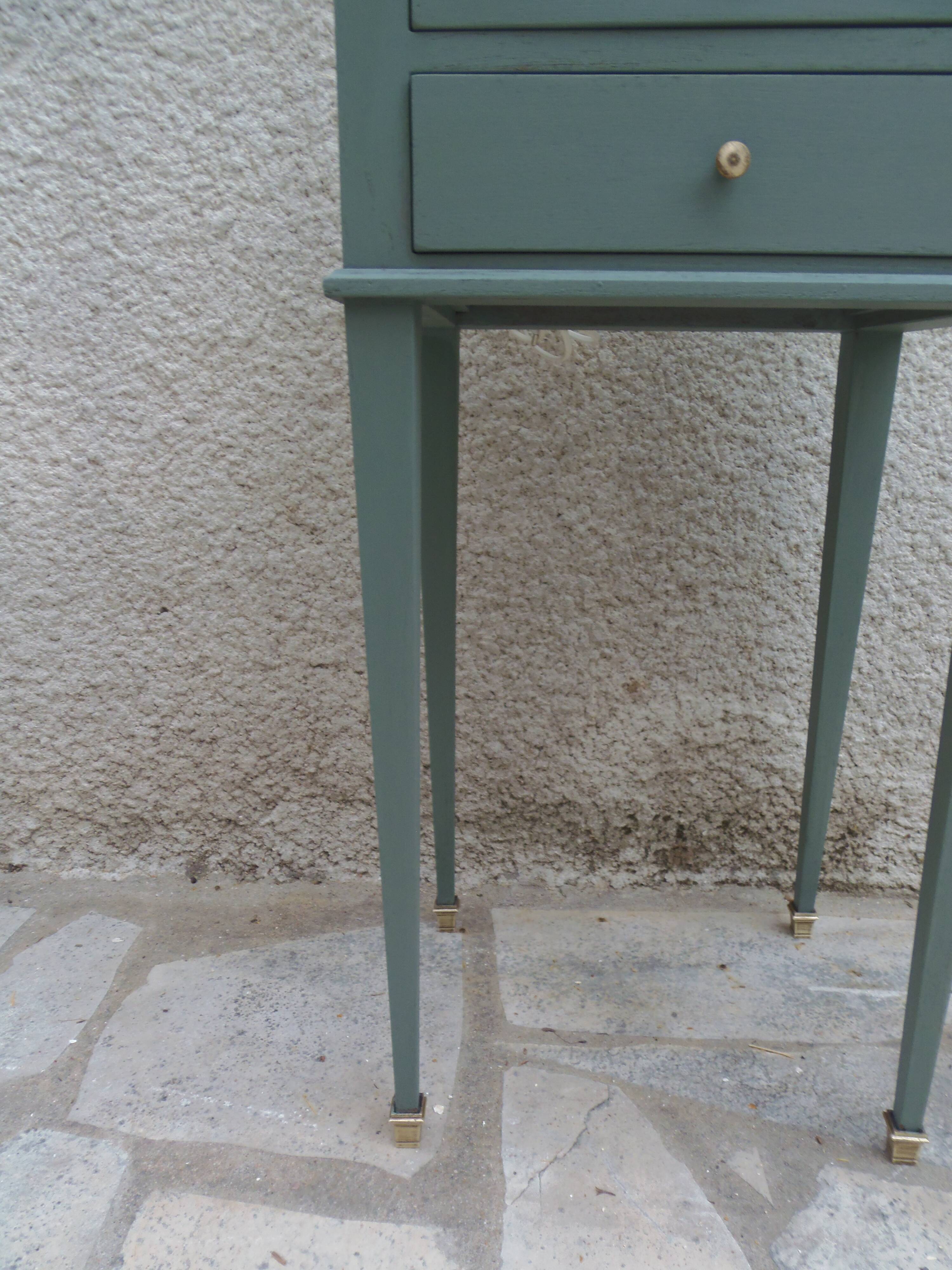 Bedside table, coffee table enhanced in smoky green, wooden top.
