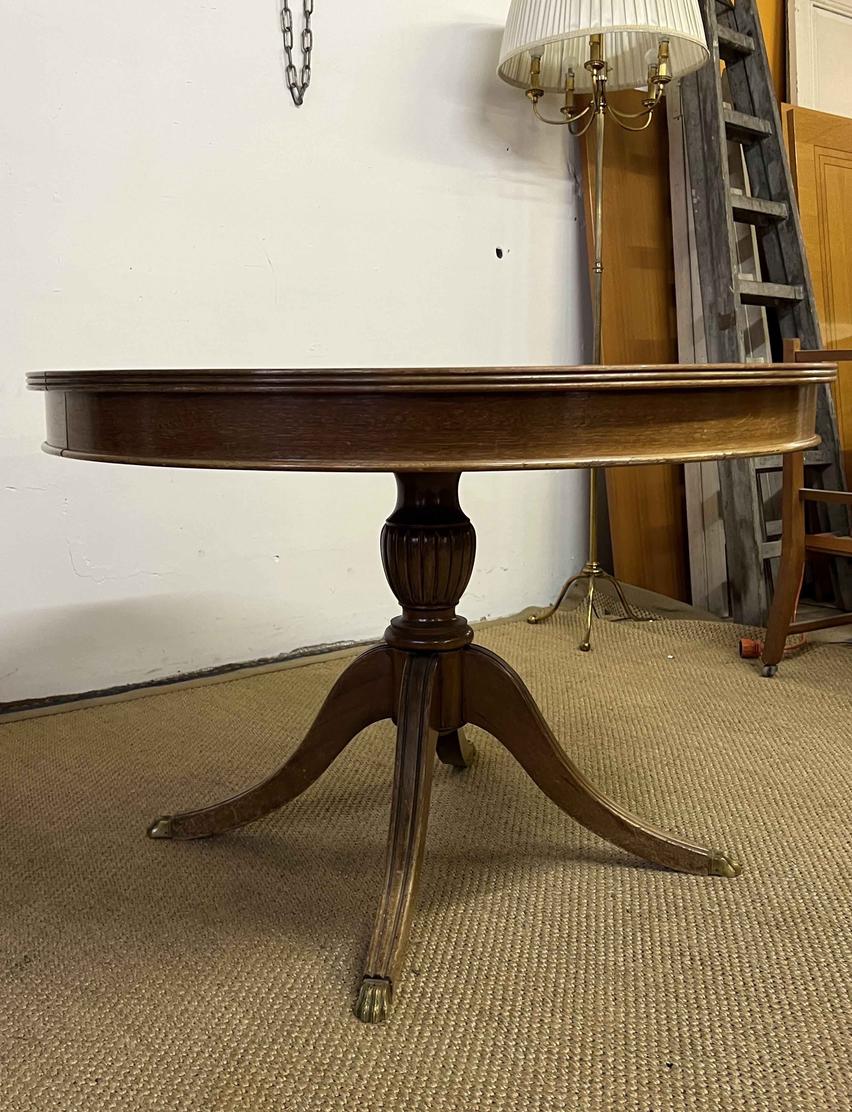 Empire style round table "Lion's Paws"