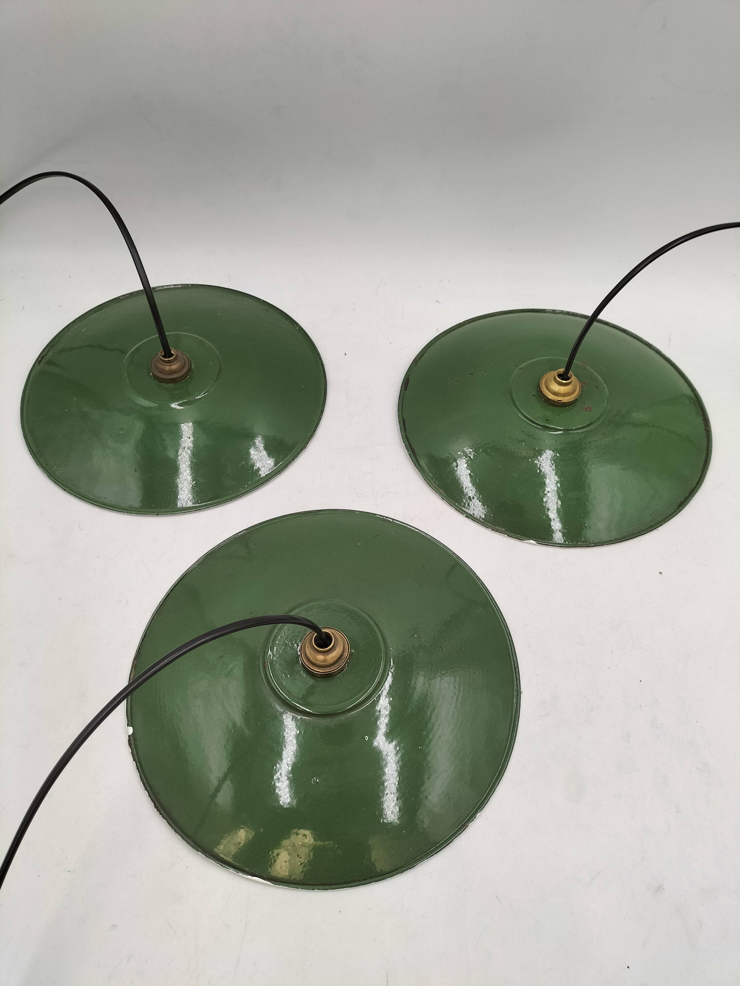 Three enamelled sheet metal suspensions