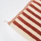 A handmade Moroccan striped terracotta rug, 150/250cm