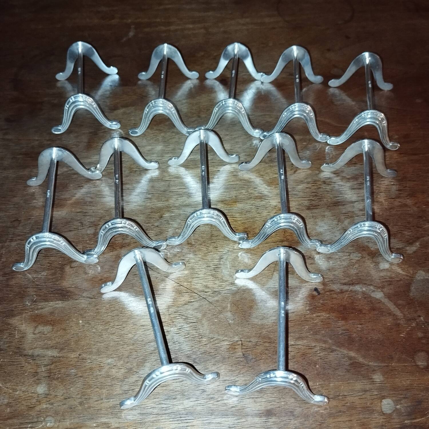 12 Art Deco silver-plated knife rests