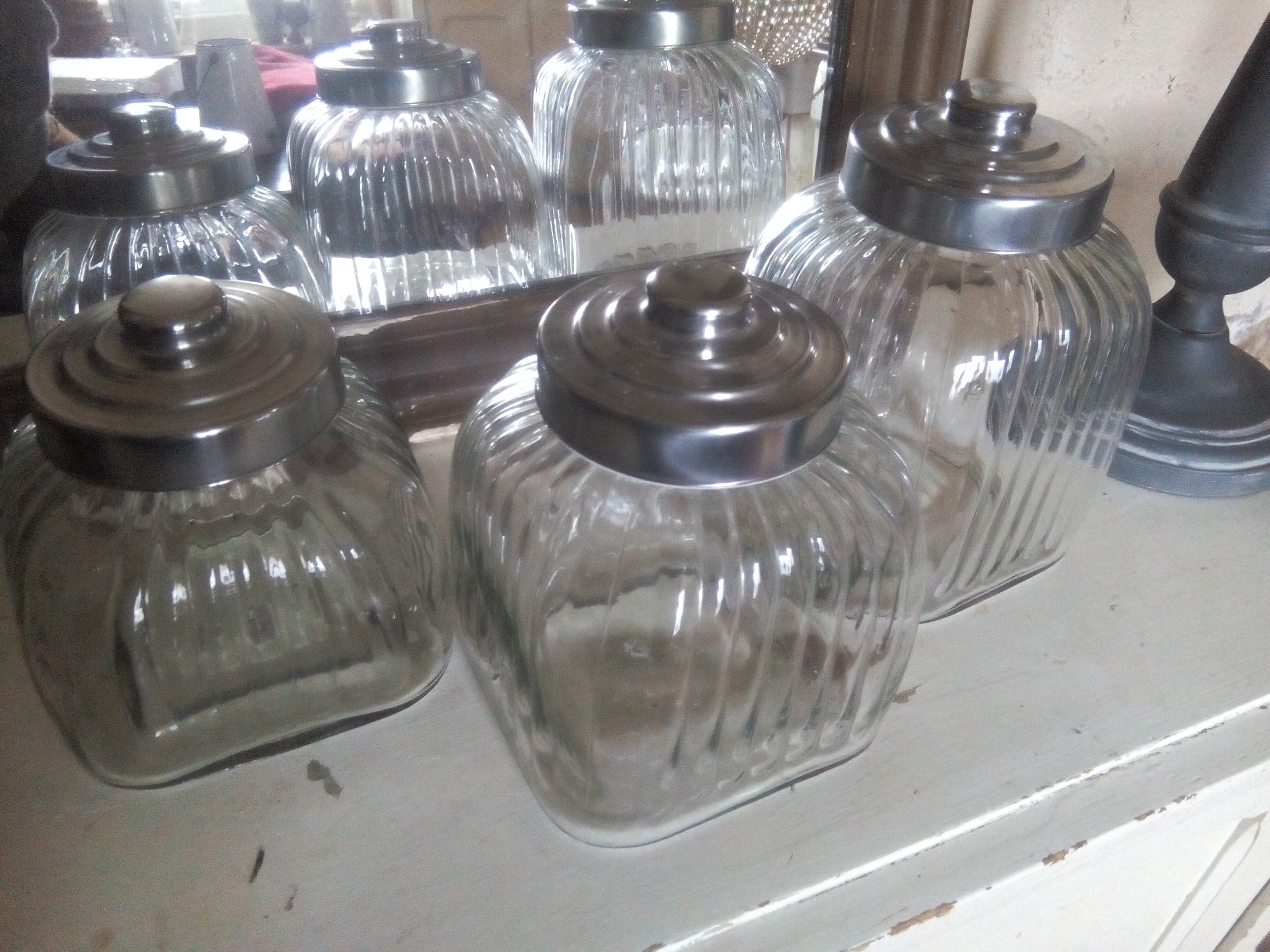 three large glass jars