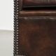 luxury dark leather club chair with English-style ball feet