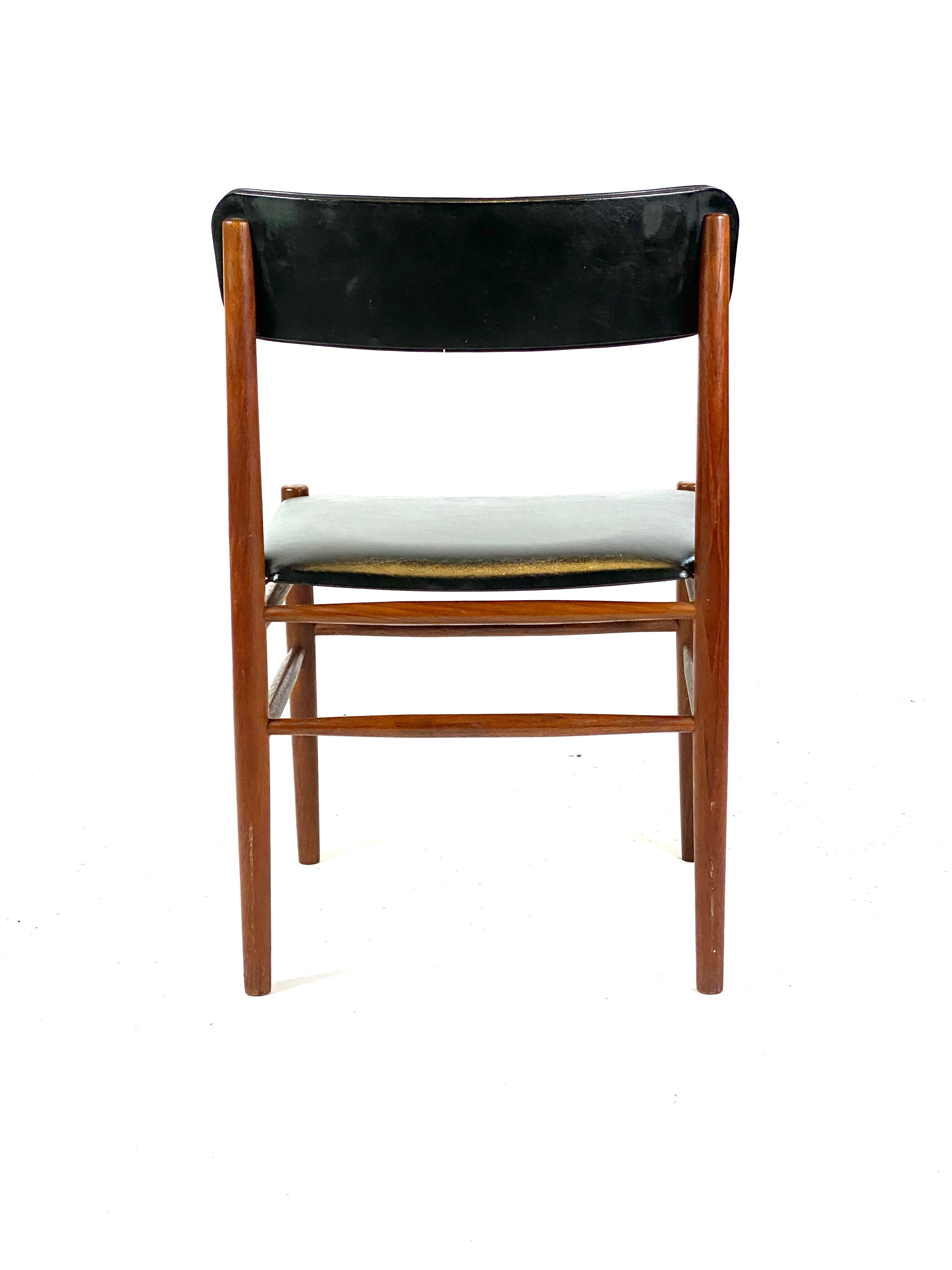 Two dining room chairs in teak and upholstered with black leather of Danish design, 1960s