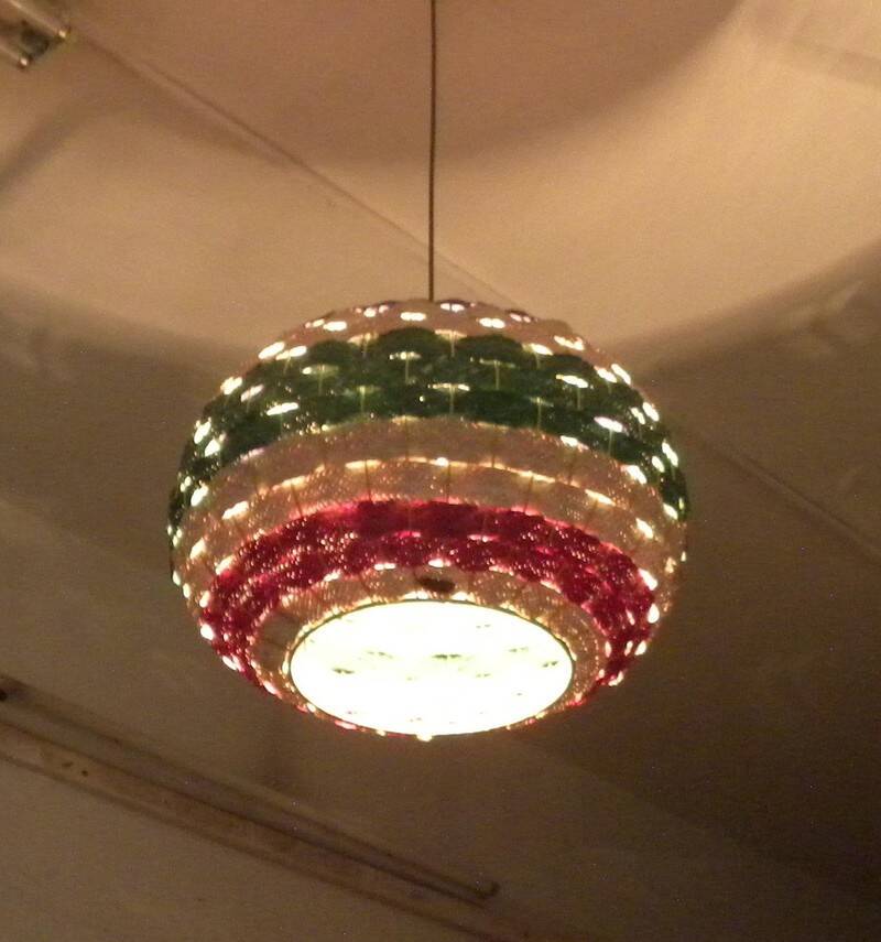 Handmade suspension in coloured woven natural plant fibres.