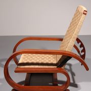 An exceptionally rare mahogany recliner crafted in Italy during the 1950s"