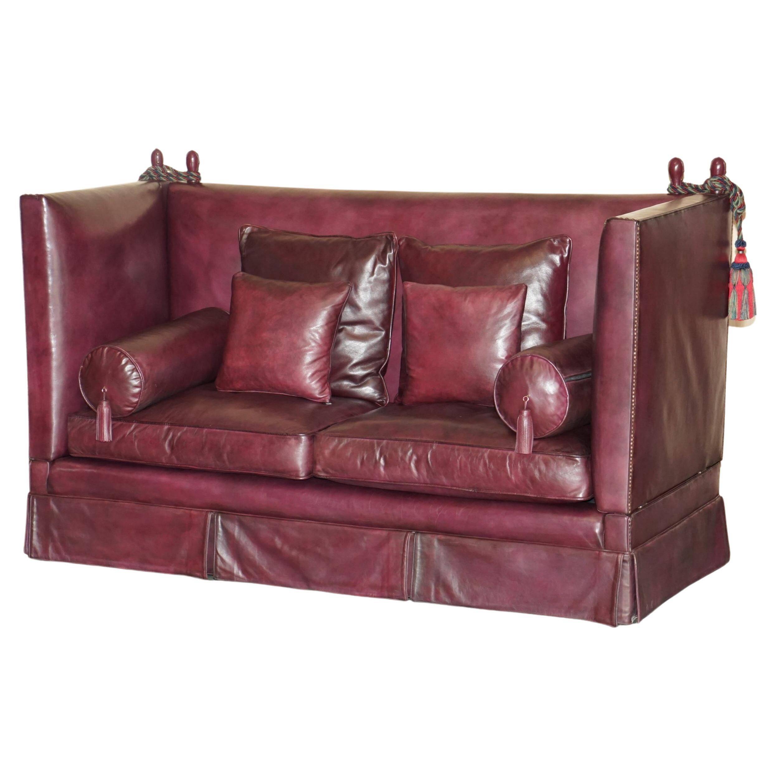 Victorian Knole canapé restored in leather with feather cushions.