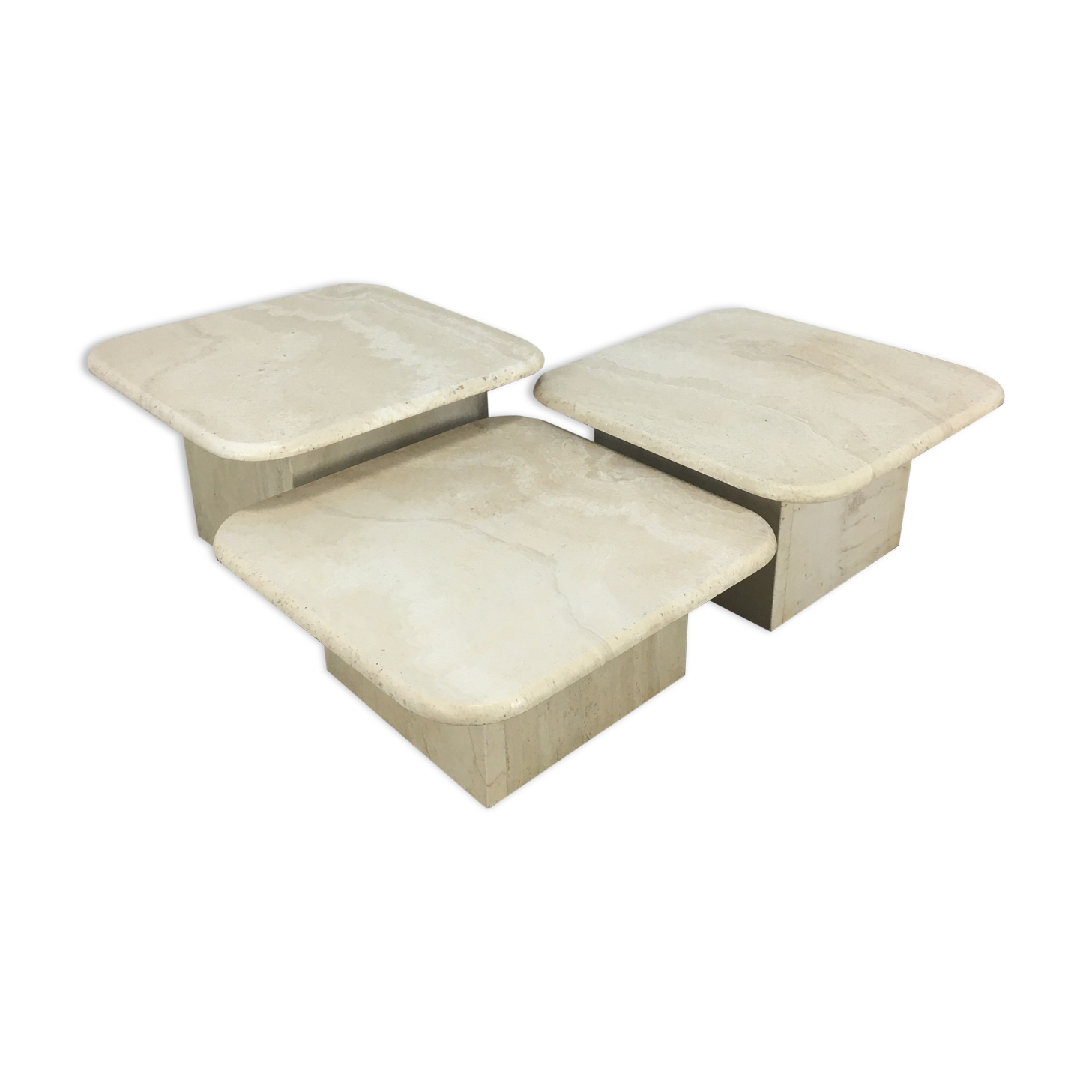 Three travertine trundle coffee tables