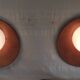 Globe-shaped wall sconces in opaline glass and wood - mid-20th century