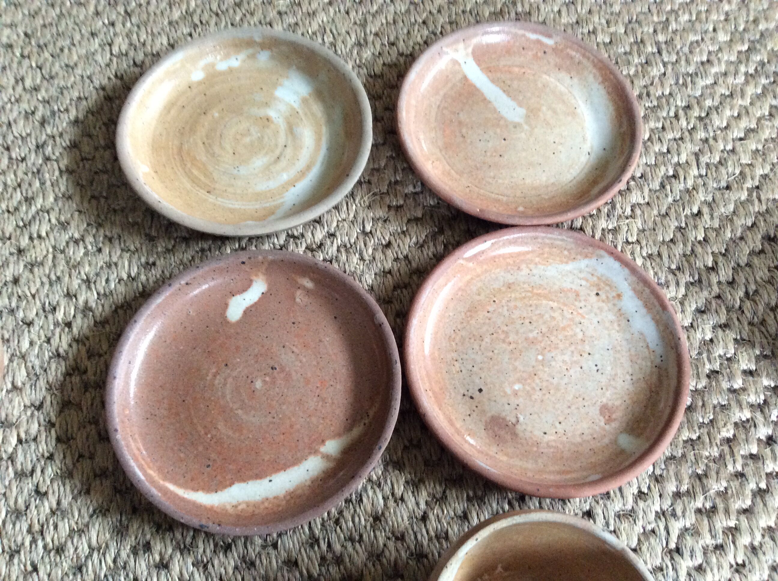 Series of 4 stoneware coffee cups