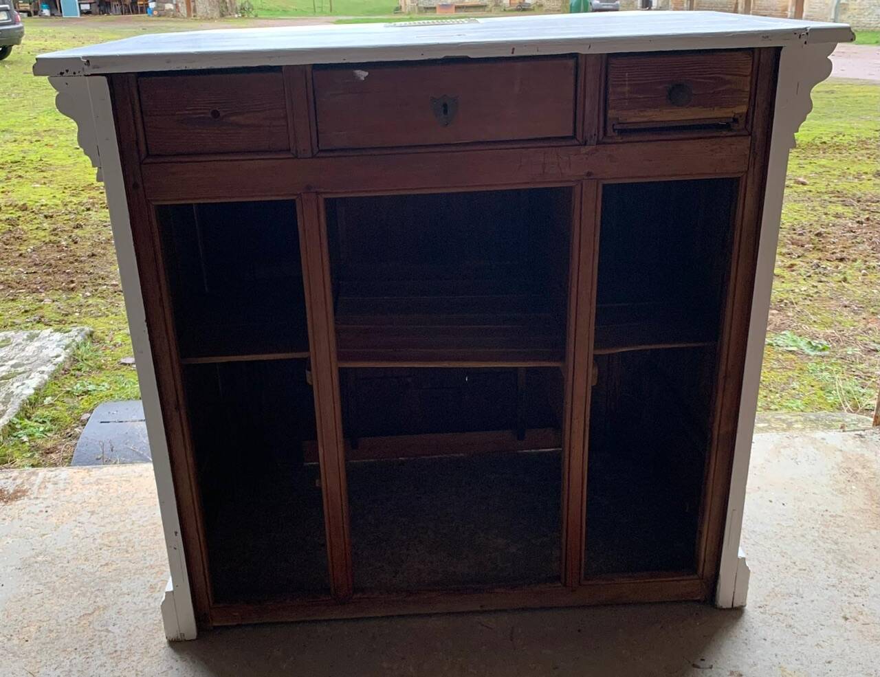 White counter with brass coin mechanism