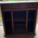White counter with brass coin mechanism
