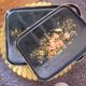 Black wooden tray with gilding and Russian motifs painted with red and green flowers