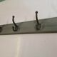 Wooden coat rack with cast iron hooks
