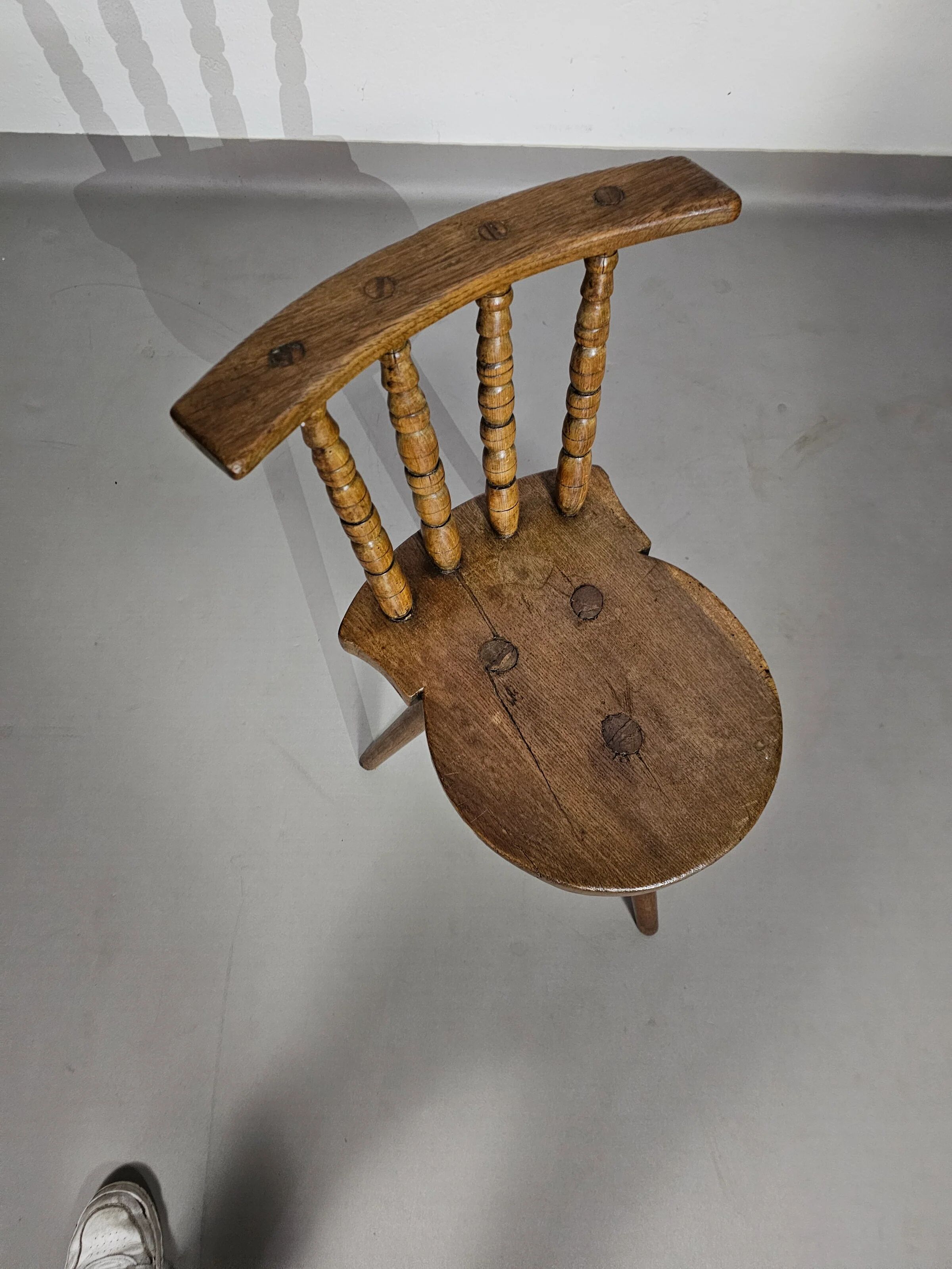 Old farmers tripod chair for decorative use