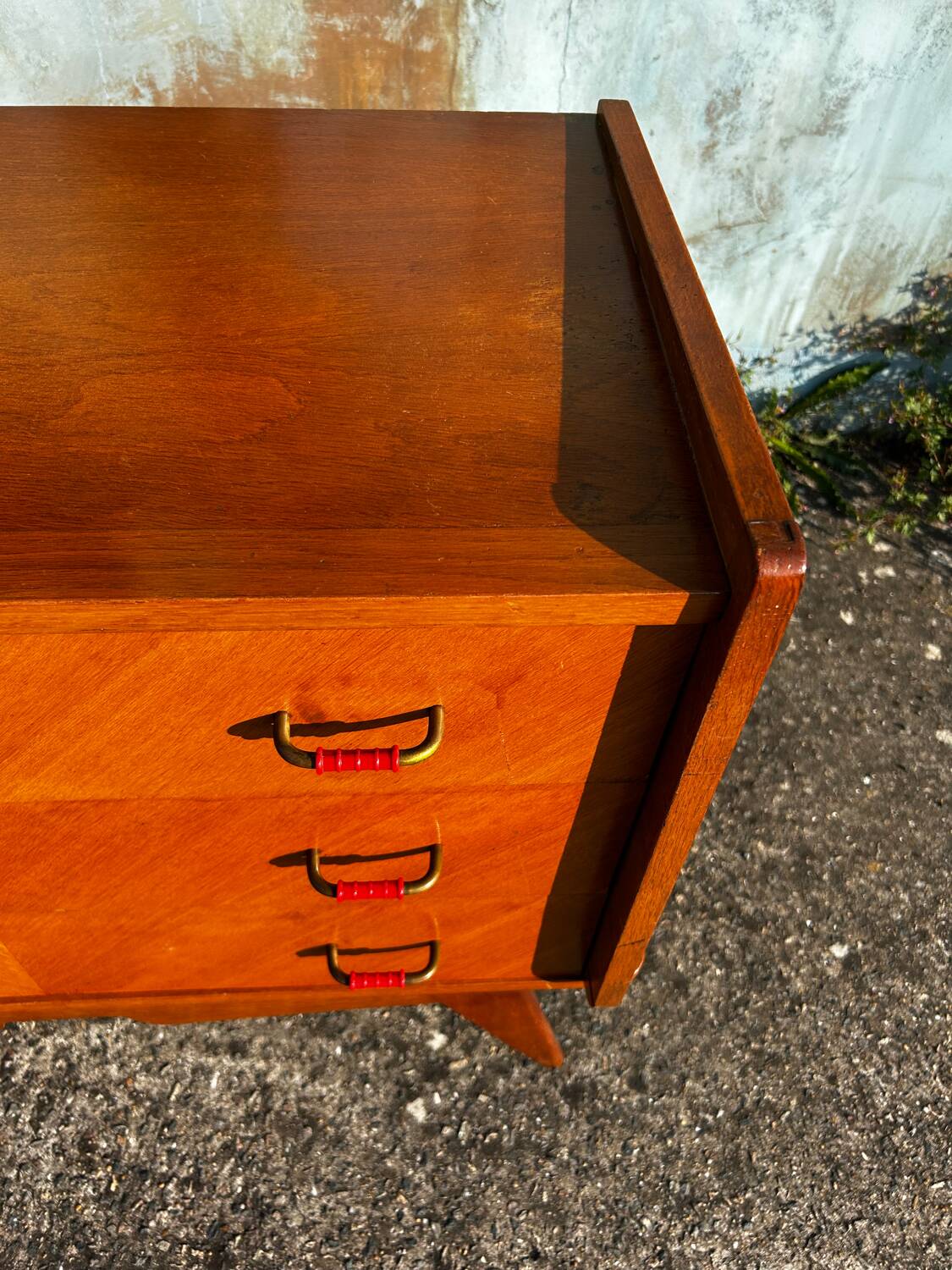 Vintage chest of drawers with compass feet.