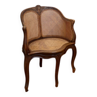 Cane seat armchair from the 19th century in the Louis XV style, known as "couillard".