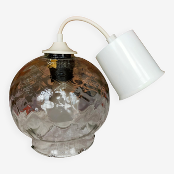 Pendant light with polished glass globe in checkerboard design