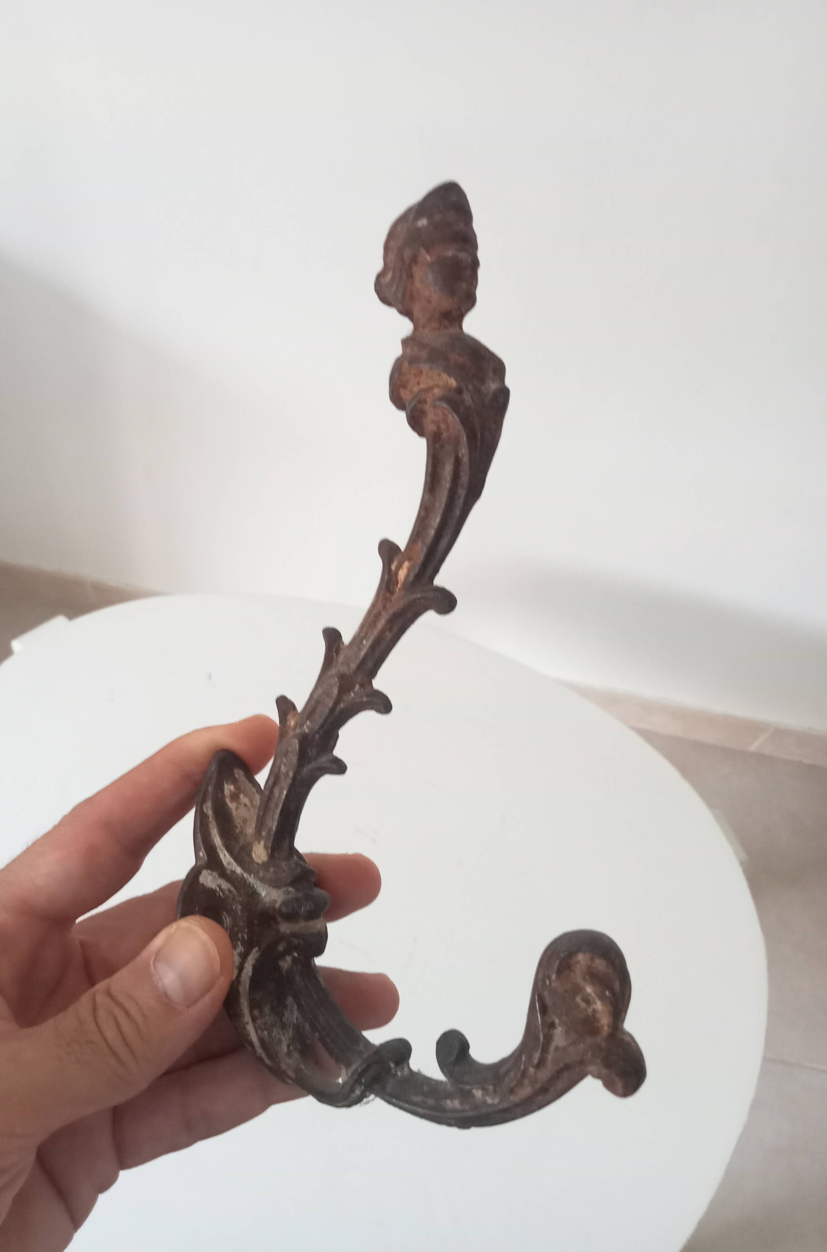 Antique wall coat hook from the 19th century in Victorian cast iron style.