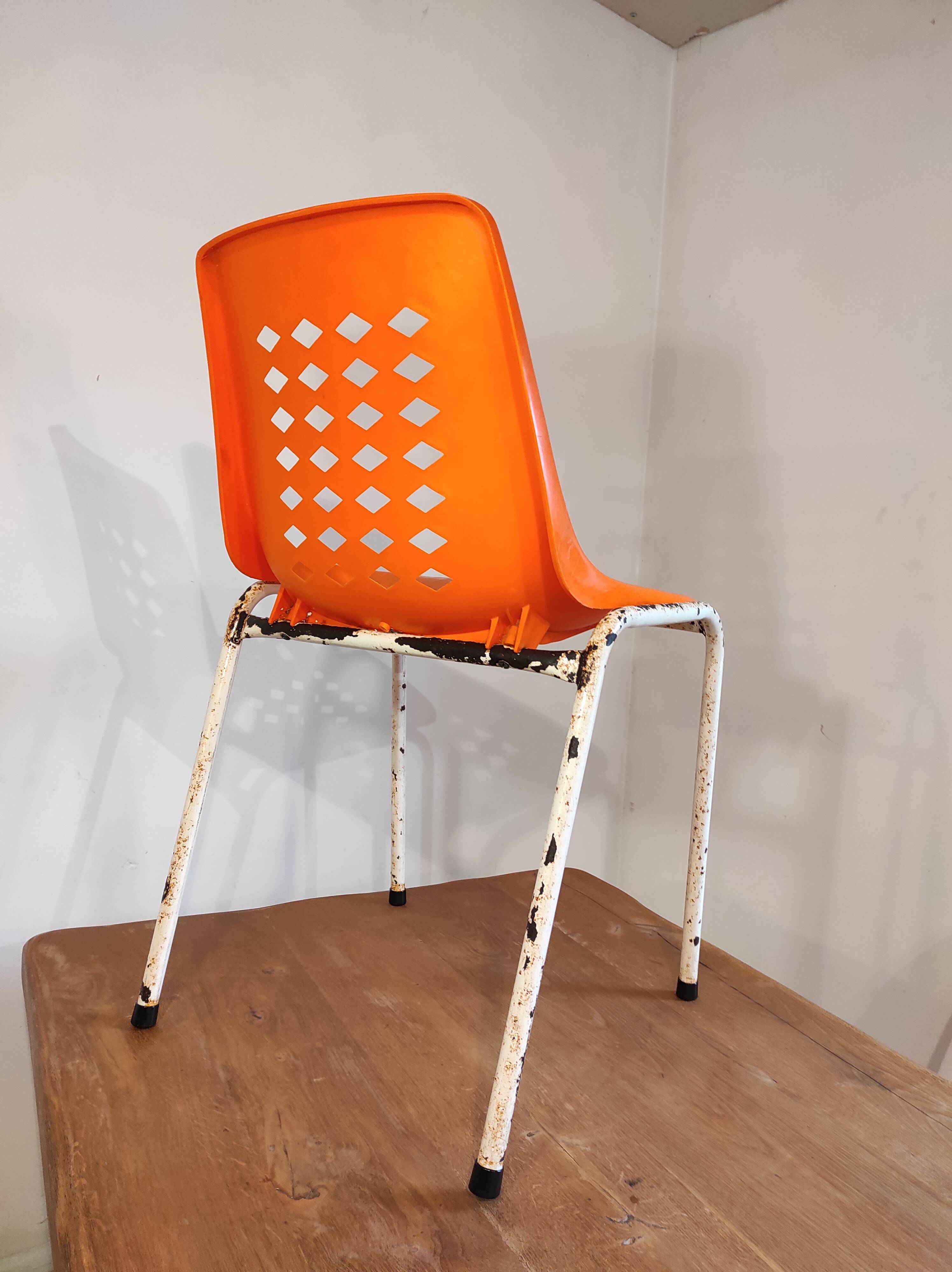 Chair with openwork plastic shell 1970