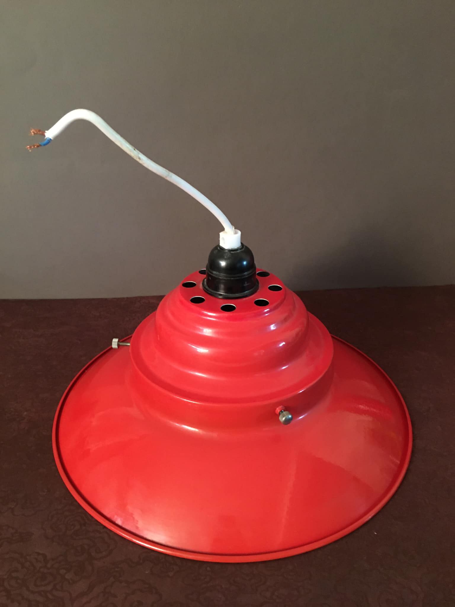 Industrial suspension in red metal