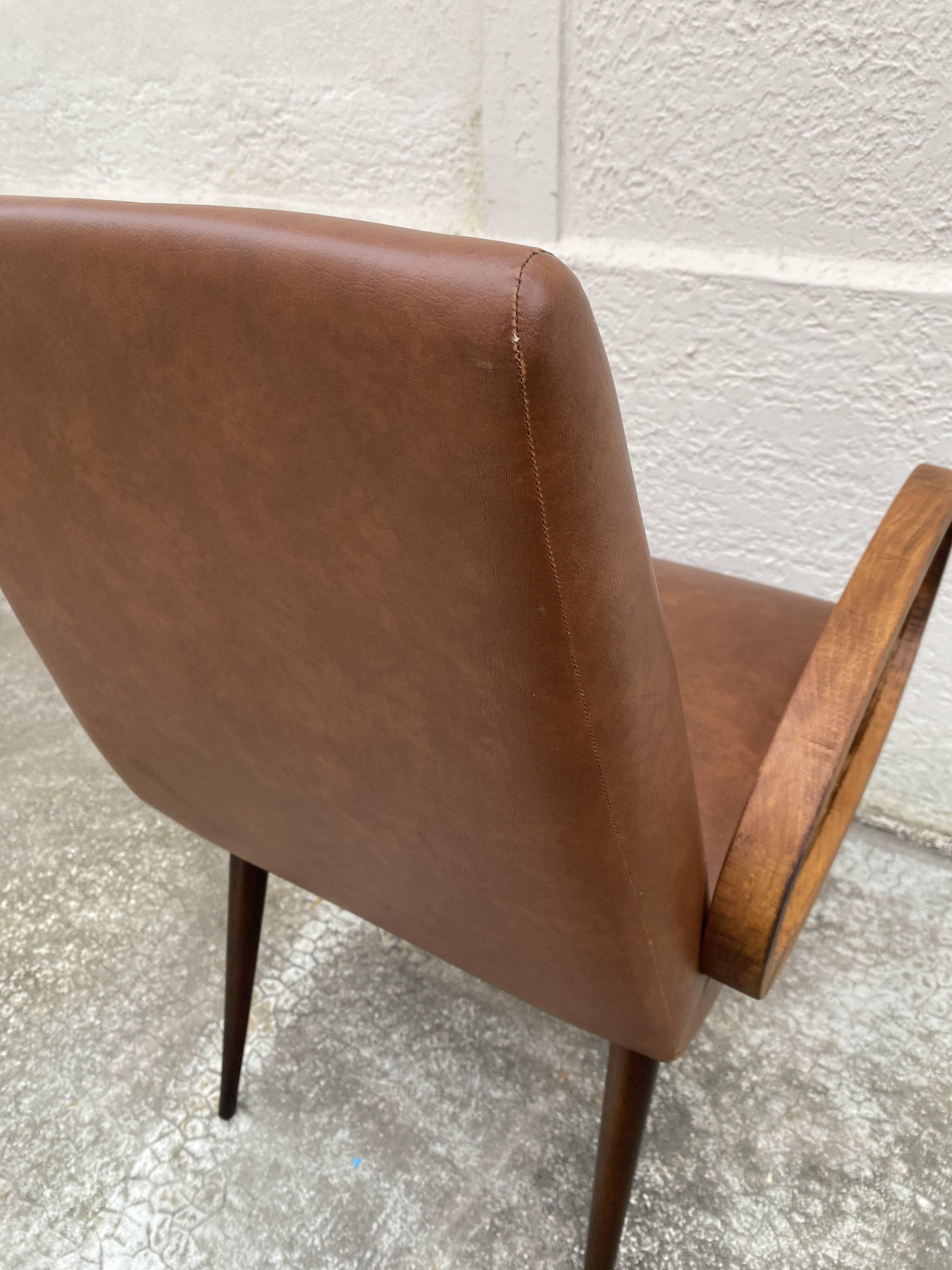 Mid-Century Scandinavian vintage retro armchair with oval armrests.