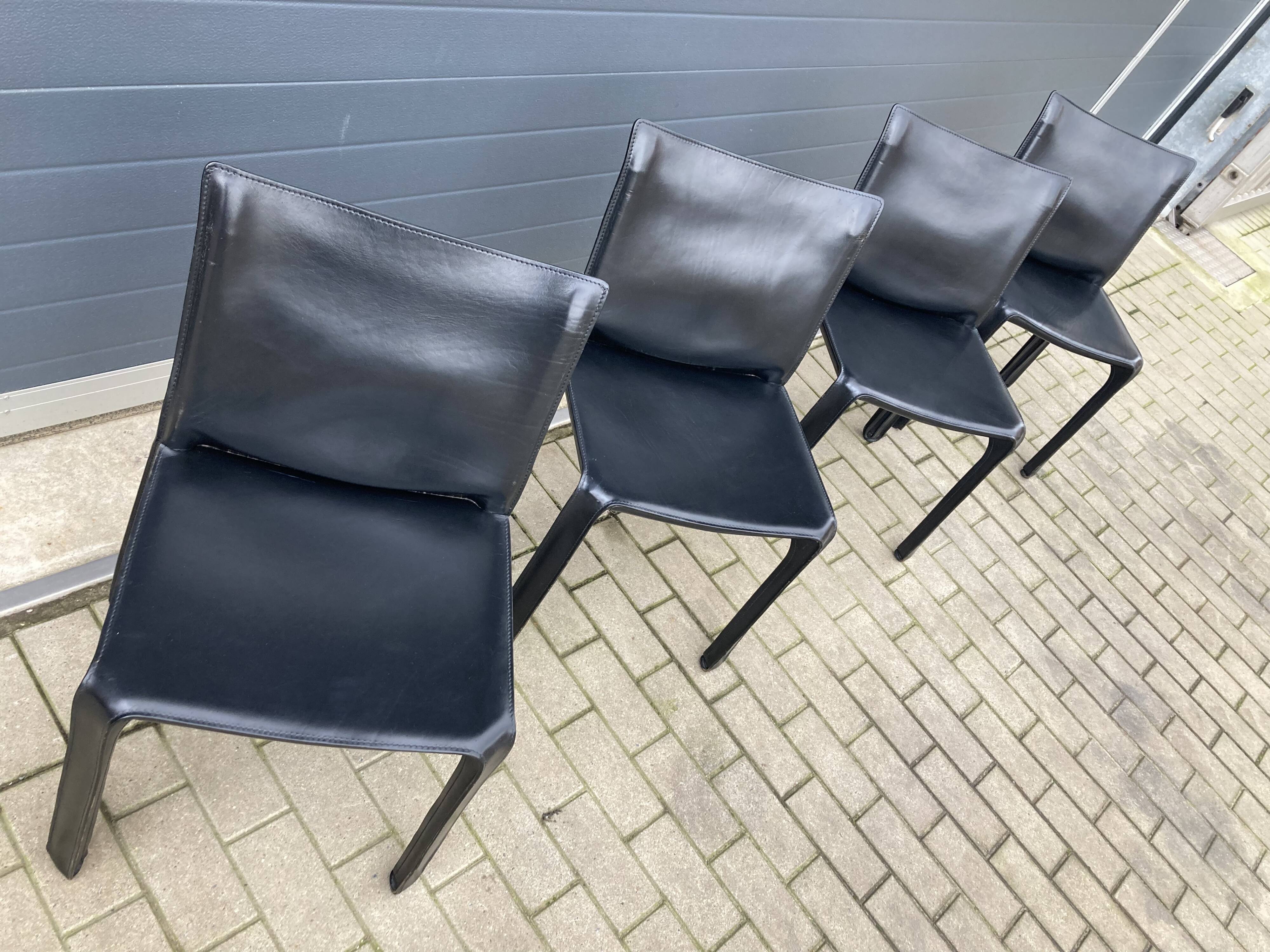 4 black Cassina Cab chairs by Mario Bellini