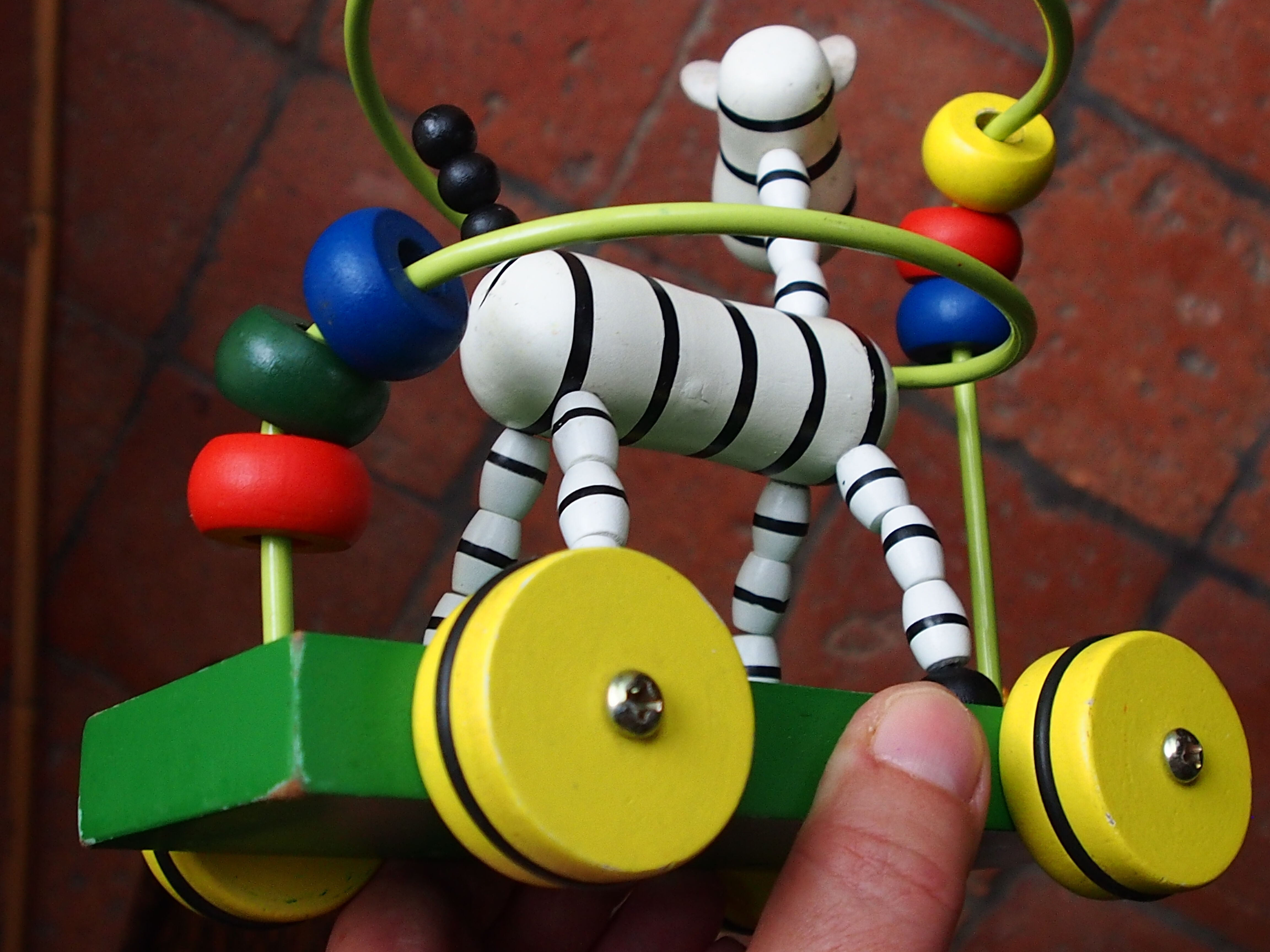 Old wooden toy, zebra car, to pull and push