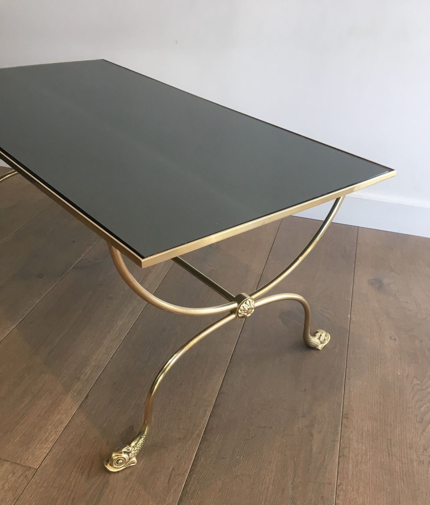 Neoclassical brass style coffee table with dolphin head decoration