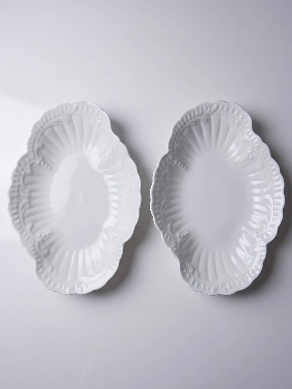 Vintage duo of Chastagner Limoges serving dishes, white rocaille porcelain.